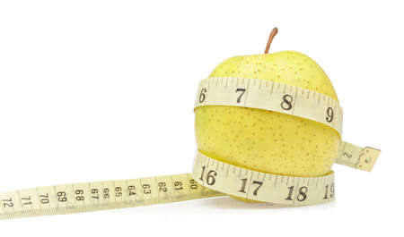 Green apple with measuring tape isolated on white background