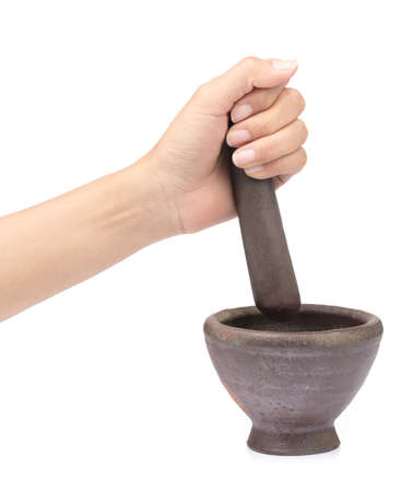 Mortar in a female hand isolated on white backgroundの写真素材