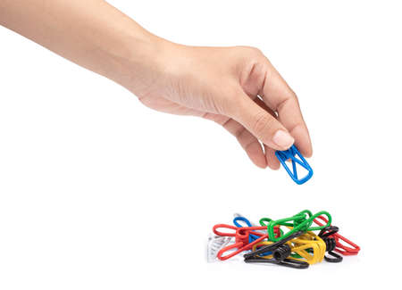 hand holding wire spring hose clips isolated on white background