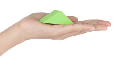 Hand holding Toy Wooden Geometric Shape Isolated on white Background.の写真素材