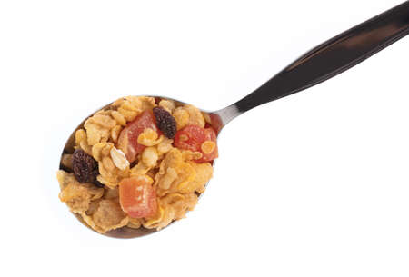 Cereal on spoon isolated on white background.