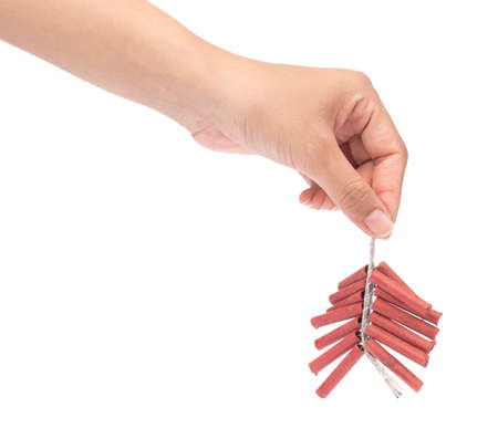 hand holding Red firecrackers string isolated on white backgroundの写真素材
