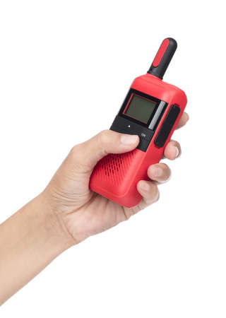 Hand holding Red radio communication isolated on a white backgroundの写真素材