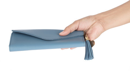 Hand holding leather blue wallet purse isolated on white background