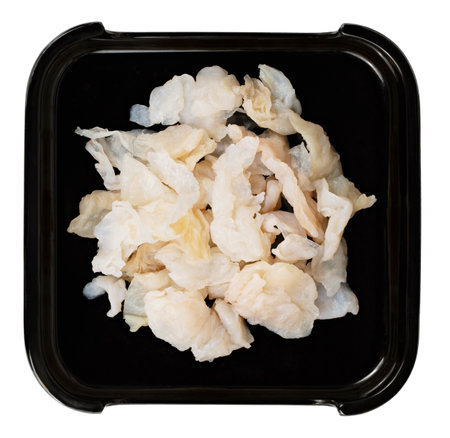 Jellyfish in a black dish isolated on white background