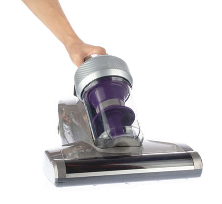 Hand holding Vacuum Cleaner, for Bedding and Cushions, Anti Dust Mite, isolated on white backgroundの写真素材