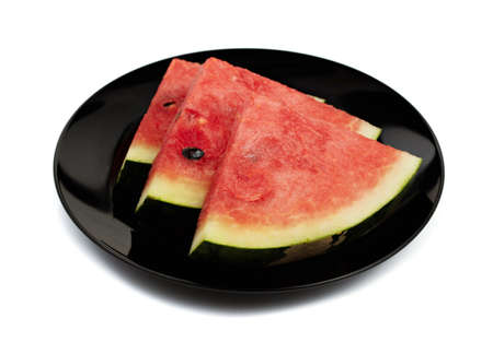 watermelon slices on dish black isolated on white background