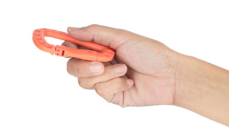 Hand holding Climbing carabiner clip isolated on white backgroundの写真素材