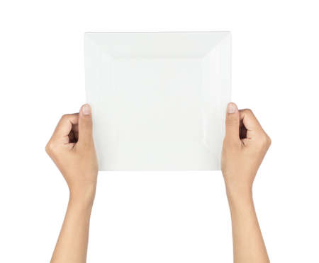 Hand holding Empty plastic plate isolated on white backgroundの写真素材