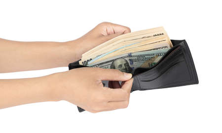 Hands taking out cash from purse isolated on white background