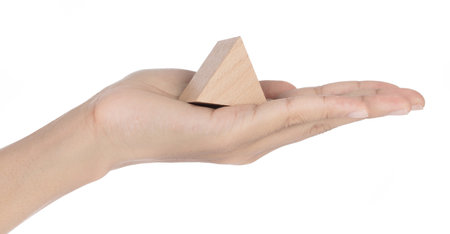 Hand holding Toy Wooden Geometric Shape Isolated on white Background.の写真素材