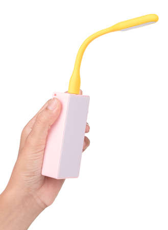 hand holding usb LED light lamp isolated on white background.