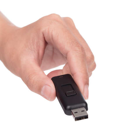 Hand holding USB flash memory isolated on a white background.の写真素材