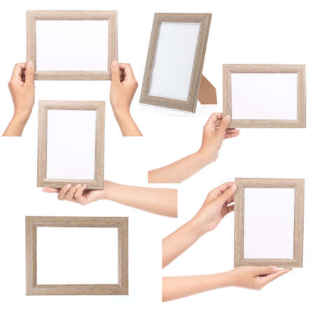 Collection of hand holding wood frame isolated on white background.の写真素材