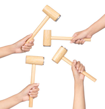 Collection of hand holding wood hammer  isolated on white background.