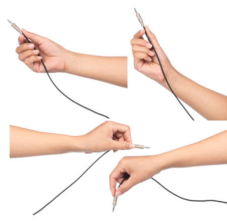 Collection of hand holding Audio jack connection of microphone isolated on white background.