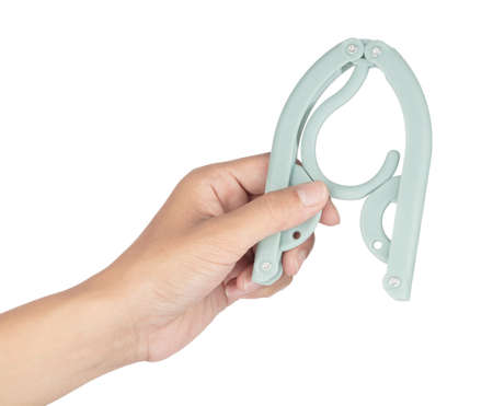 Hand holding Coat Hanger Foldable isolated on white background