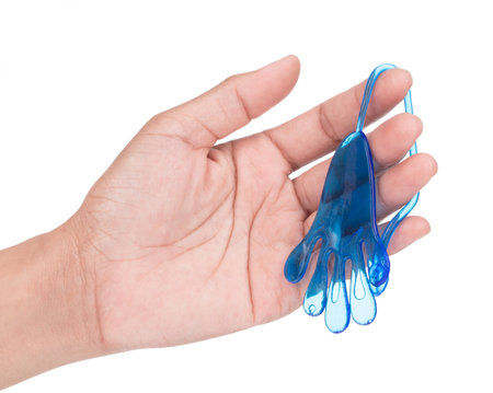 Hand holding Toy Elastic Stretchy Sticky hand shape isolated on white backgroundの写真素材
