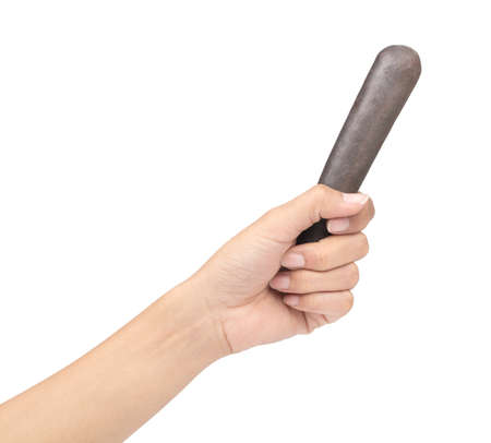 hand holding pestle isolated on white background