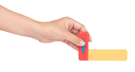 hand holding toy construction square ruler isolated on white background
