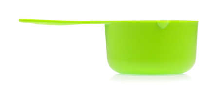 green plastic scoop isolated on white backgroundの写真素材