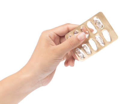 hand holding empty pills pack isolated on white background.