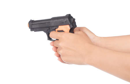 hand playing with a toy gun isolated on white backgroundの写真素材