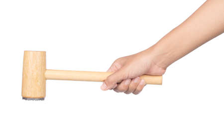 hand holding wood hammer with a rubber handle isolated on white backgroundの写真素材