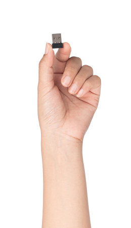 hand holding USB flash drive isolated on white background. High resolution.の写真素材
