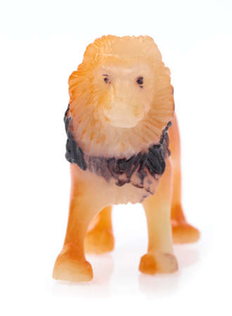 plastic lion isolated on white backgroundの写真素材