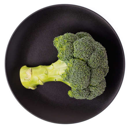 black plate of Broccoli isolated on white background