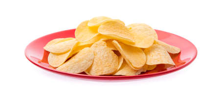 Potato chips on dish isolated on white backgroundの写真素材