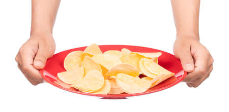 hand holding dish of Potato chips isolated on white background