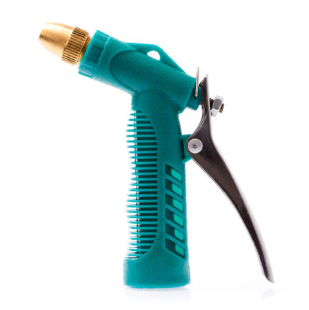Nozzle on a hose for watering. Hose nozzle spraying water isolated on white background.