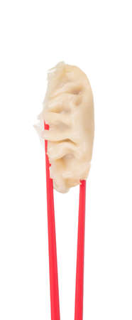 wontons with chopsticks isolated on white background.の写真素材