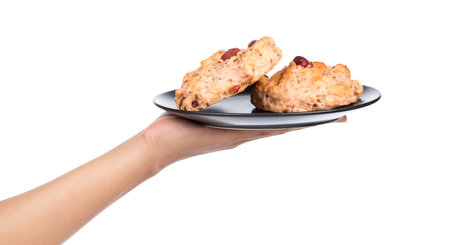hand holding strawberries bread on dish isolated on white background.の写真素材