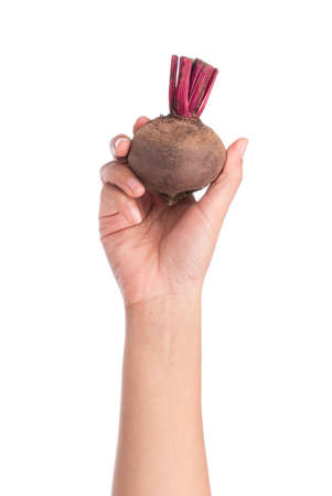 hand holding beetroot isolated on white backgroundの写真素材