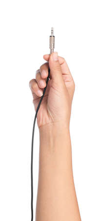 hand holding Audio Jack Plug 3.5 mm. isolated on white background