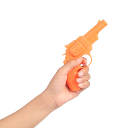 hand holding Toy Gun made of plastic isolated on white backgroundの写真素材