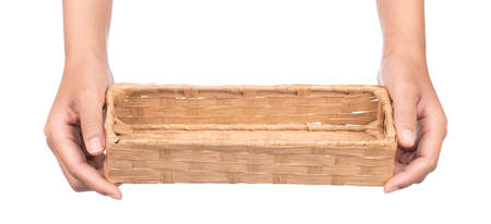hand holding bamboo tray isolated on white backgroundの写真素材