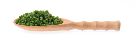 slice onion spring on ladle isolated on white backgroundの写真素材