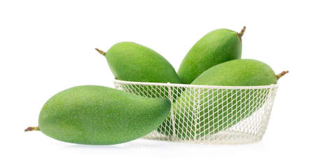 basket of fresh mango isolated on a white background.の写真素材