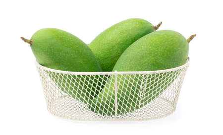 basket of fresh mango isolated on a white background.の写真素材