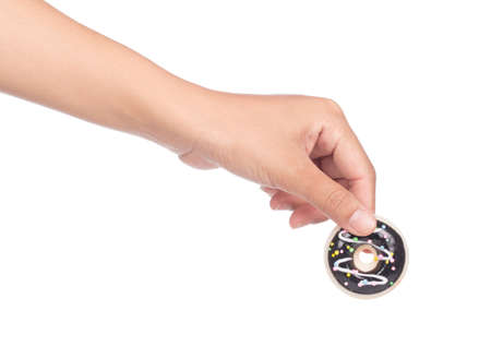 hand holding Donut with colorful sprinkles isolated on white background.