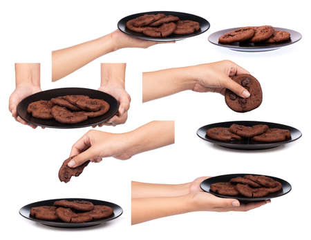 Set of hand holding chocolate chip cookies on plate isolated on white background