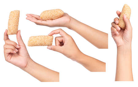 Set of hand holding snack of whie Sesame Seeds isolated on white background