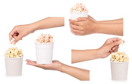 Set of hand holding pink candy popcorn in cup isolated on white backgroundの写真素材
