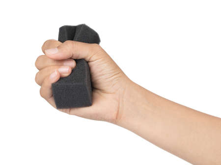 Hand holding Black sponge foam shockproof isolated on white backgroundの写真素材