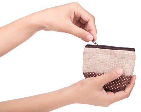 Hand holding cute of coin cloth bag isolated on white background.