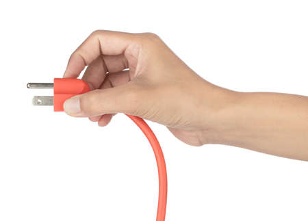 Hand holding orange extension cord isolated on white backgroundの写真素材